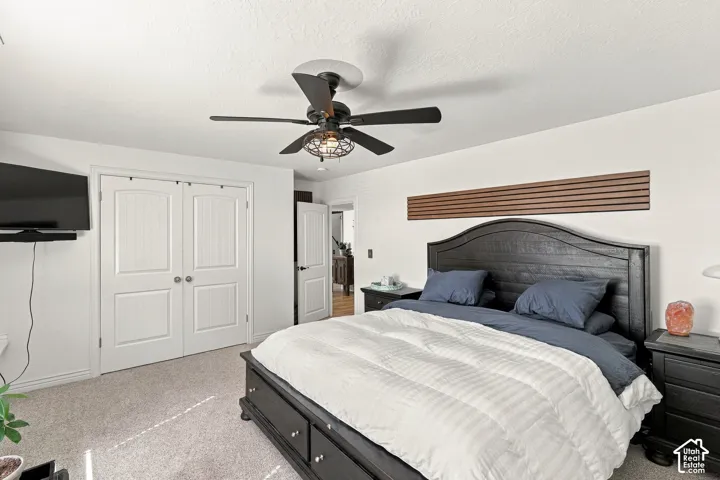 Primary Bedroom Suite with Ceiling Fan and Recessed LightingThis generously proportioned bedroom features a ceiling fan with integrated light fixture, recessed lighting throughout, and neutral wall finishes