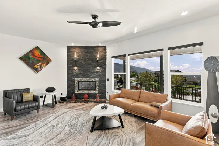 Wood-finish flooring, recessed lighting, and a modern ceiling fan