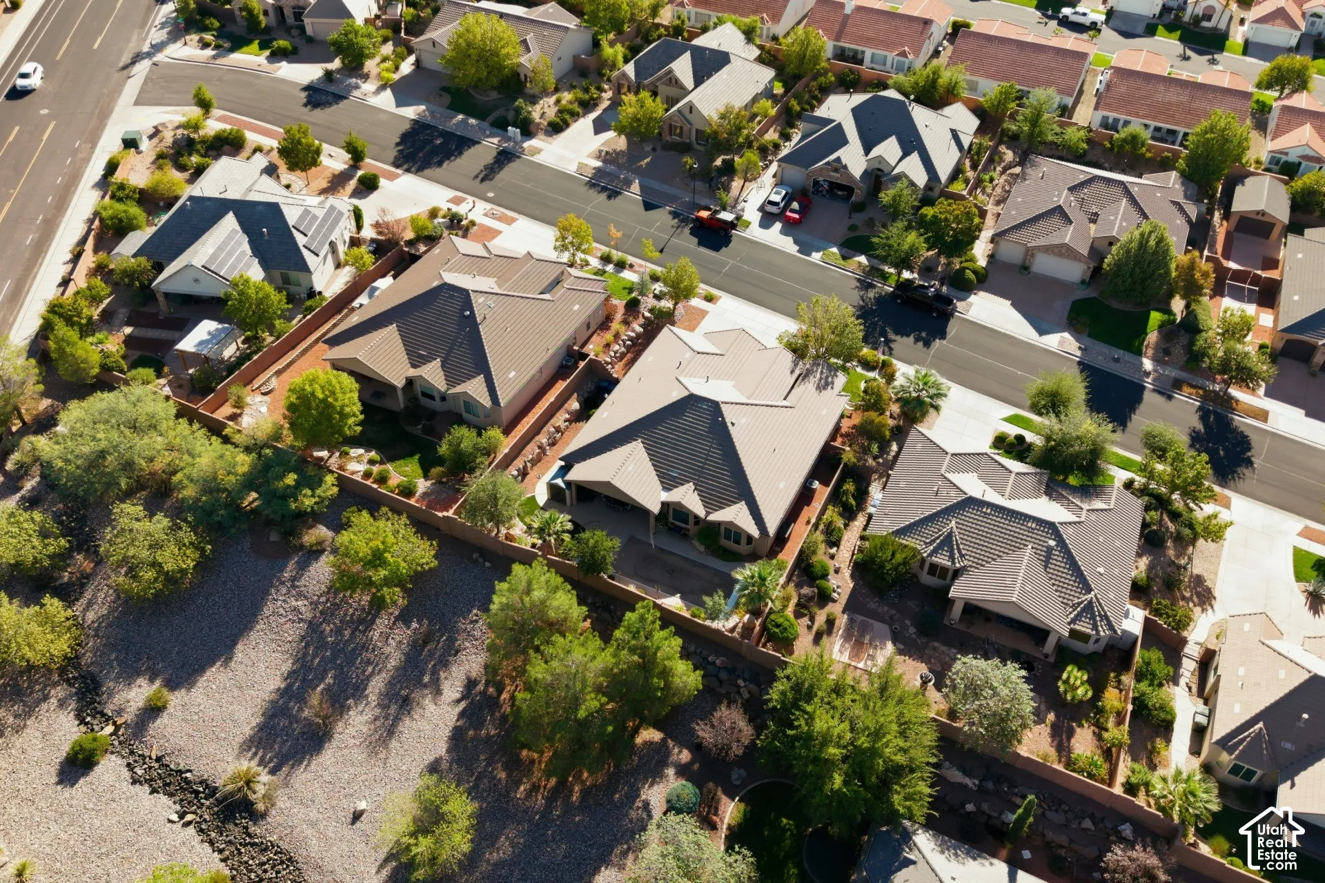 Residential properties featuring tile roofs and landscaped yards