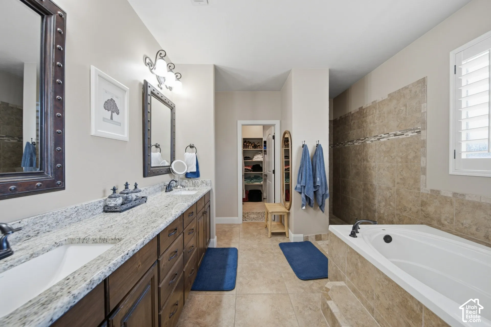 Dual vanity with stone countertops and undermount sinks