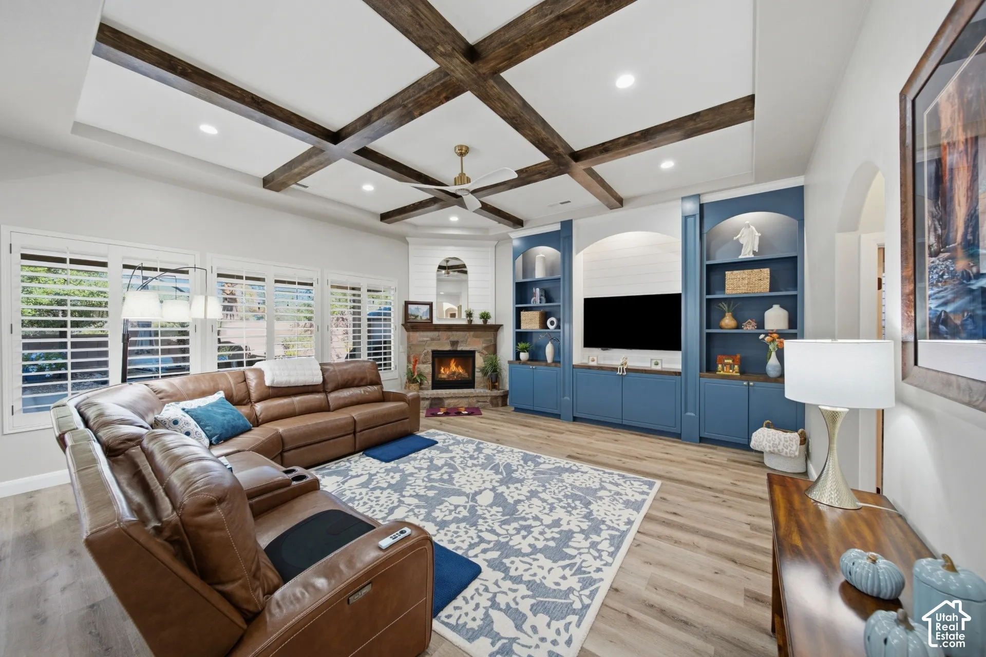 Coffered ceiling with wood beams, recessed lighting, and a ceiling fan