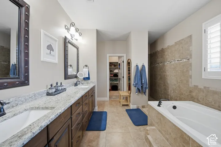Dual vanity with stone countertops and undermount sinks