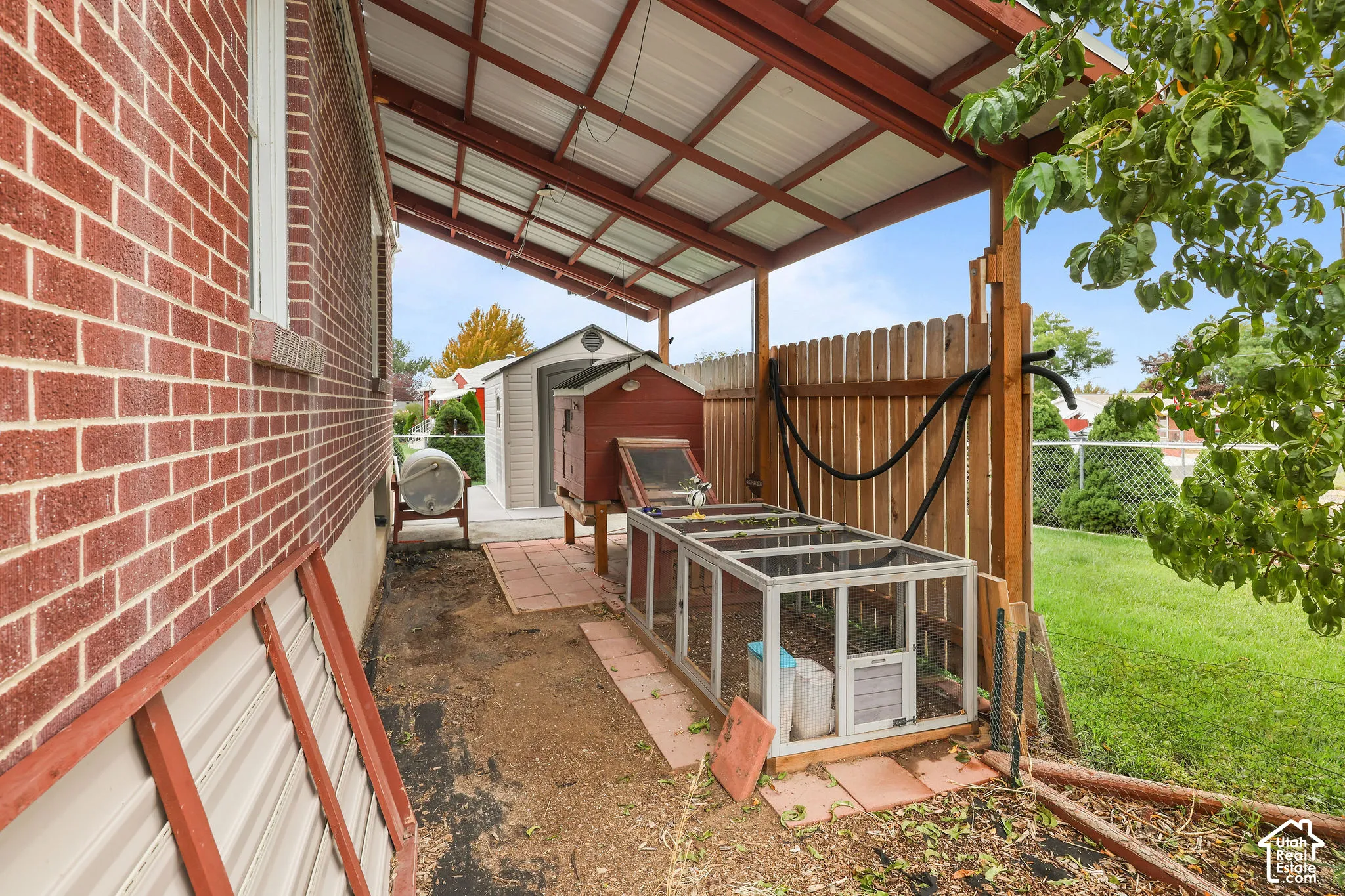 Covered patio with a metal roof and exposed wood beams