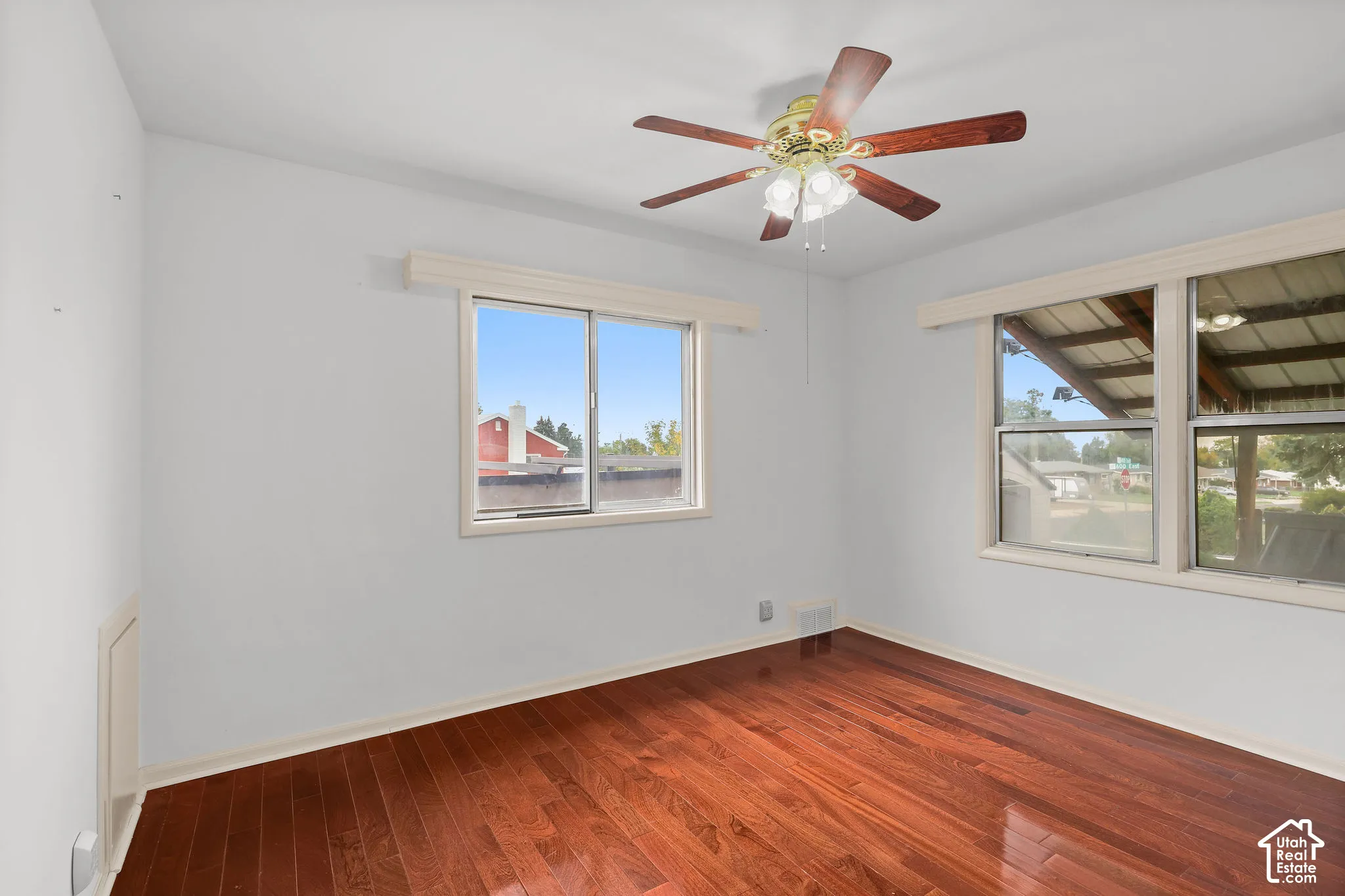 Hardwood-finish flooring with white walls and trim