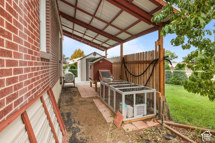 Covered patio with a metal roof and exposed wood beams