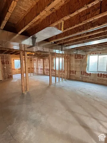 Unfinished basement with additional space for another bedroom, full size bathroom, great area, and storage.