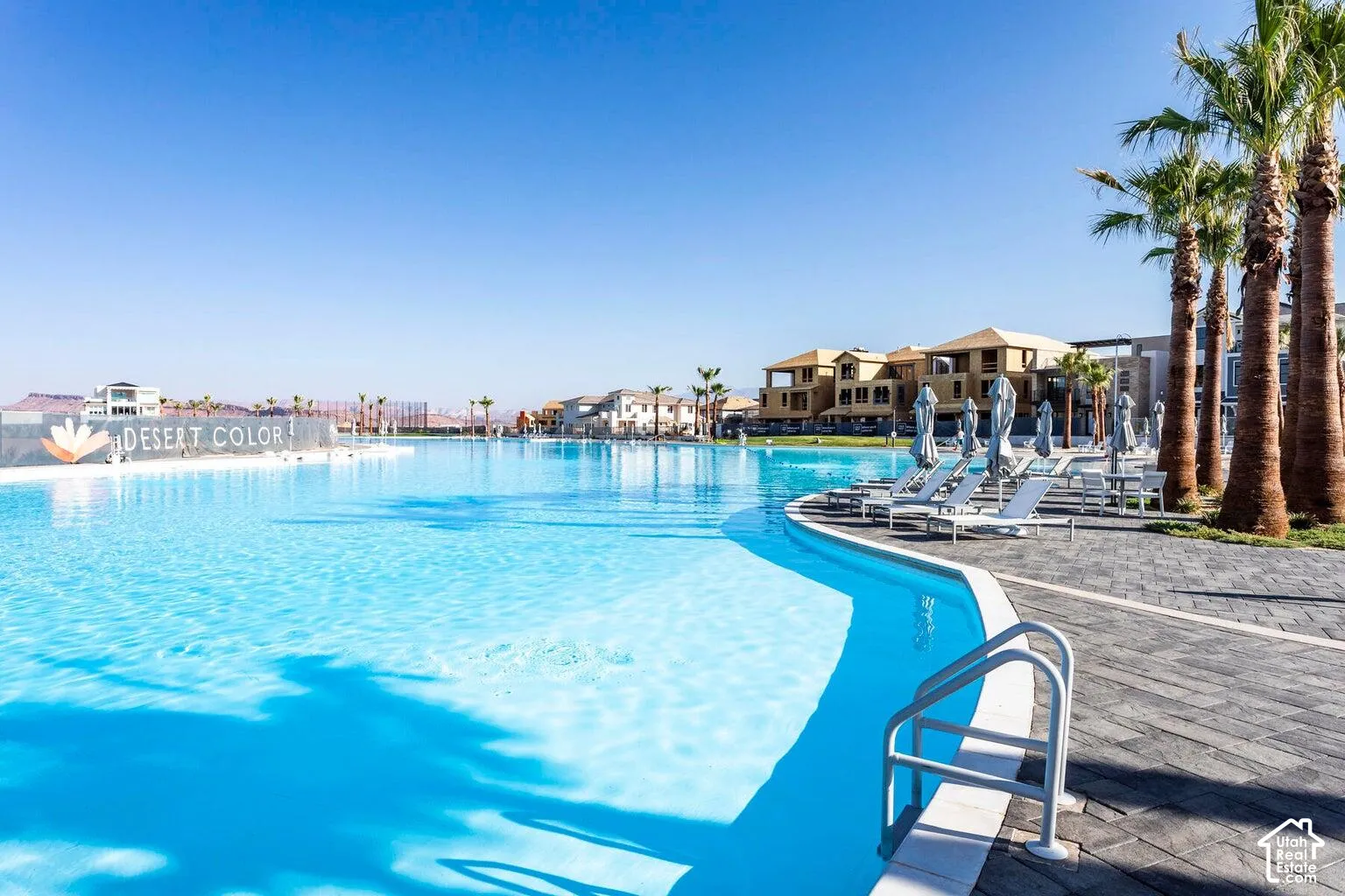 Expansive clear water body with integrated swimming area and submerged steps