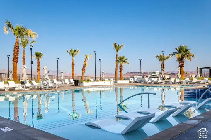 Expansive swimming pool with integrated lounge seating