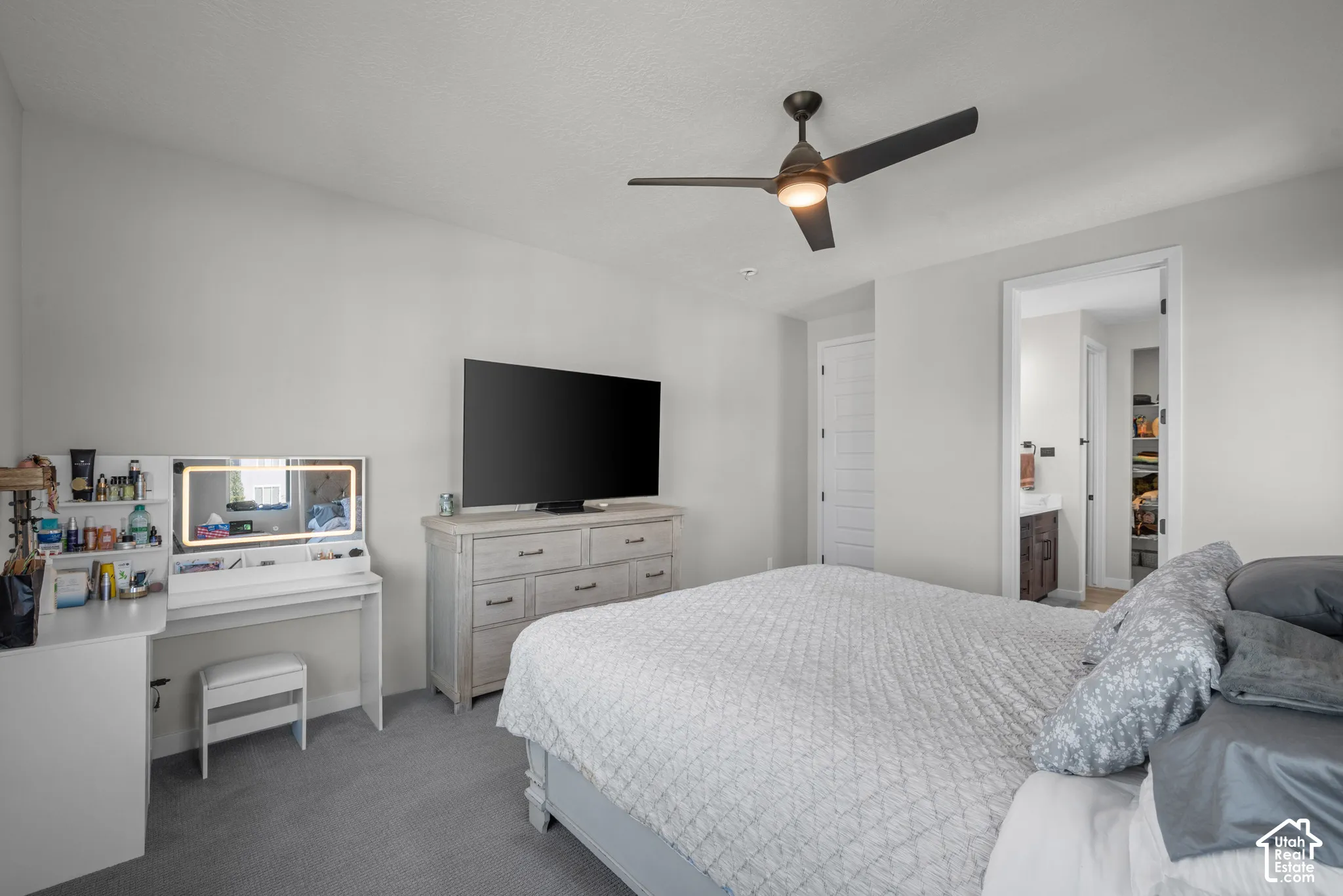 Recessed lighting, wood-finish flooring, and a contemporary ceiling fan