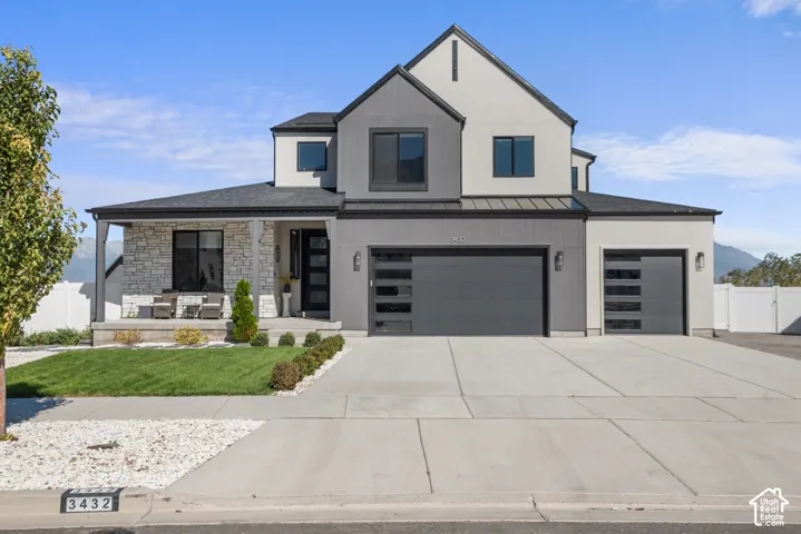 Contemporary exterior featuring stone accents and dark gray siding