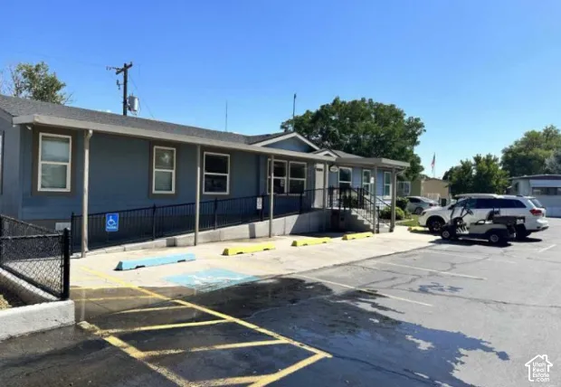 Park Office, asphalt parking area with designated stalls.