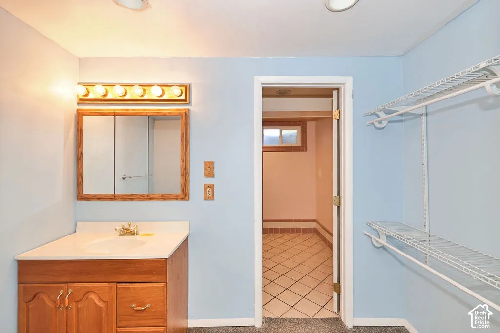 Wood-finish vanity with an integrated sink and countertop