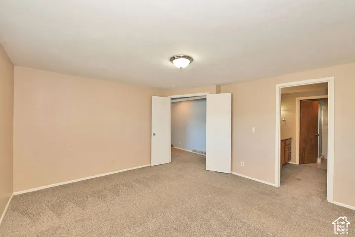 Neutral-toned wall paint and textured carpeting