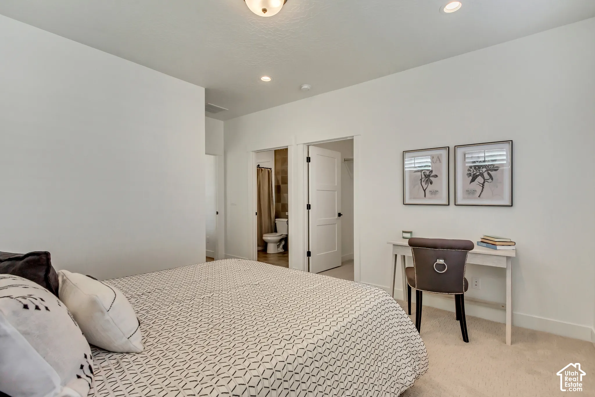Recessed lighting, ceiling-mounted light fixture, white interior doors, and neutral wall paint