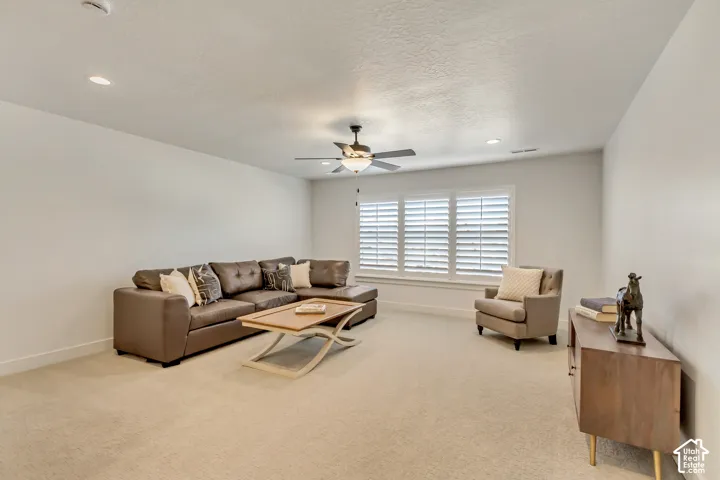 Recessed lighting, ceiling fan, carpeted flooring, and white plantation shutters