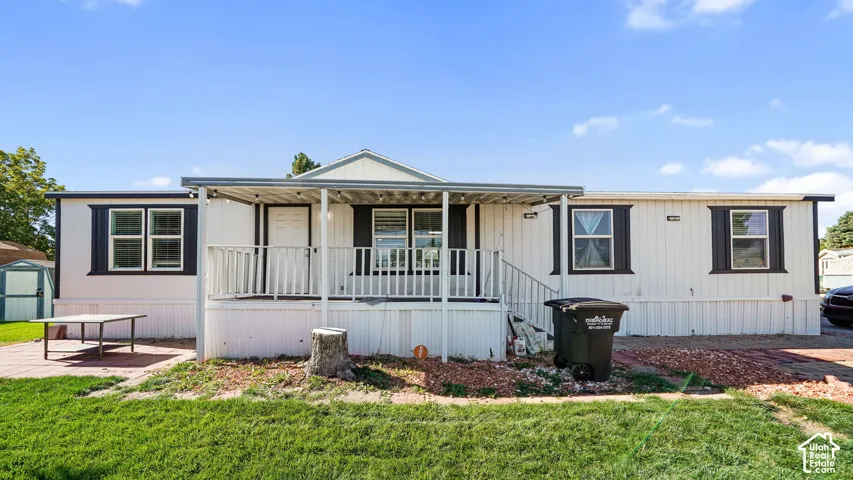 White exterior siding with dark window shutters