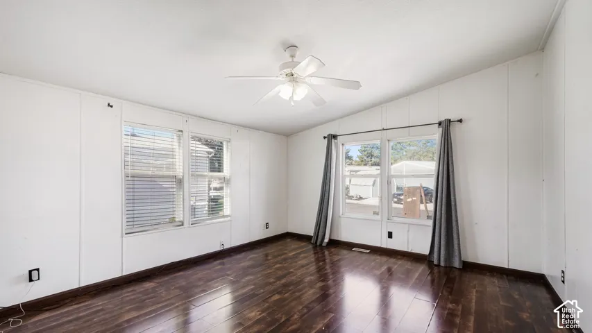 Wood-finish flooring with white panel walls