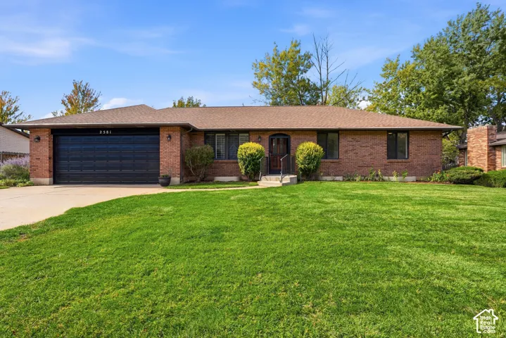 Brick exterior with a dark garage door
