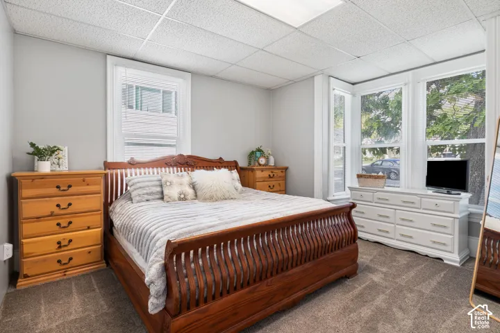 Recessed lighting, light gray wall color, textured ceiling, and multiple windows