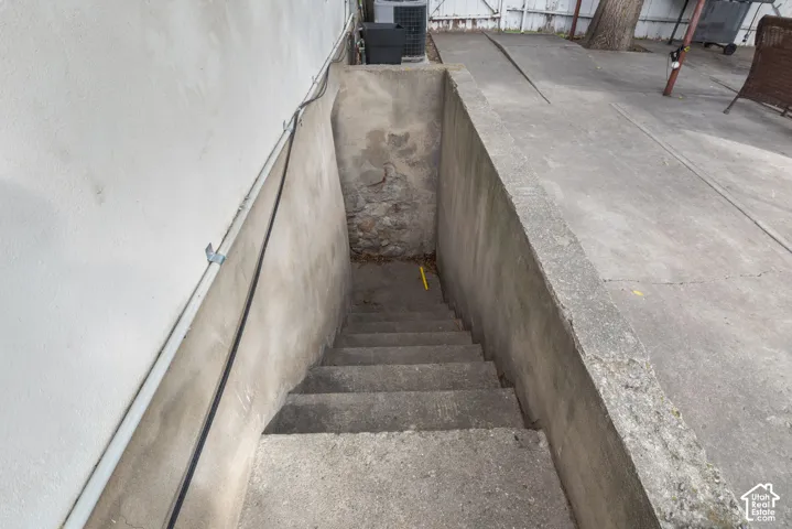 Concrete exterior staircase with an adjacent concrete ramp