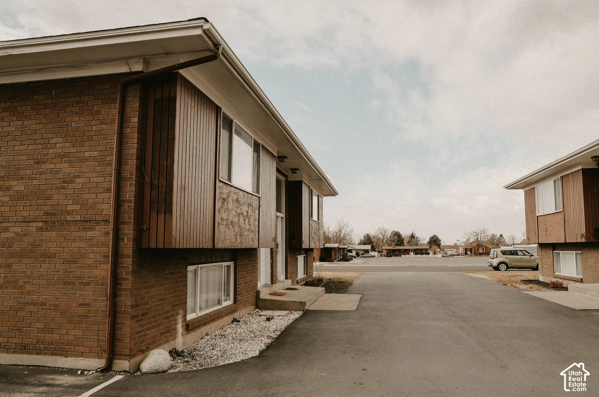 Brick exterior with wood-finish siding details