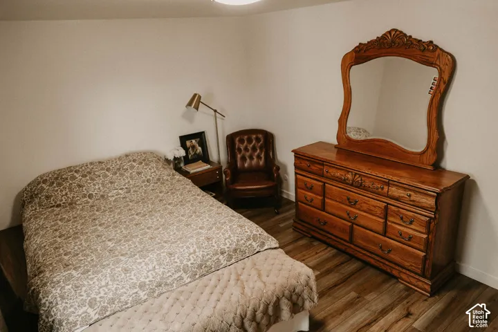 Wood-finish flooring throughout the room