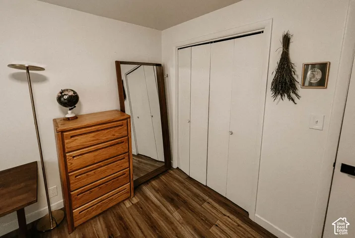 Wood-finish flooring with crisp white walls and white bi-fold closet doors