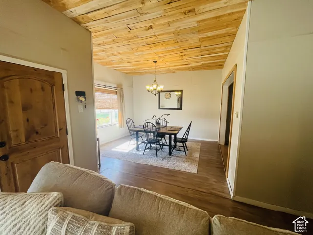 Wood-panel ceiling with a bronze chandelier