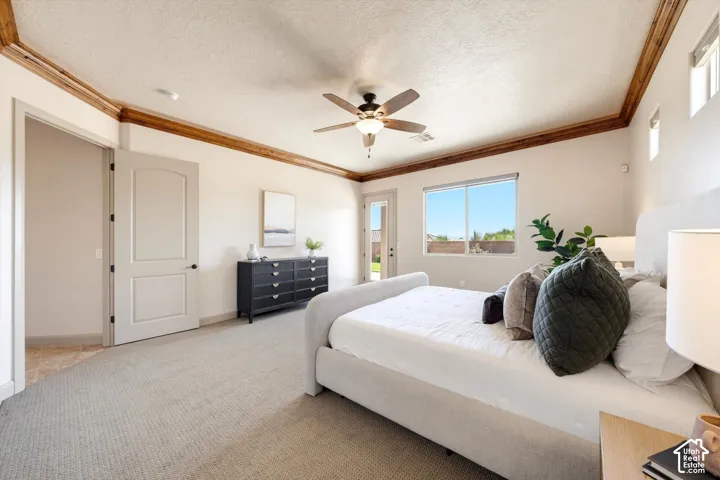 Recessed ceiling with wood-finish trim, ceiling fan with integrated lighting, glass-paned exterior door, large window, and light-toned carpeting