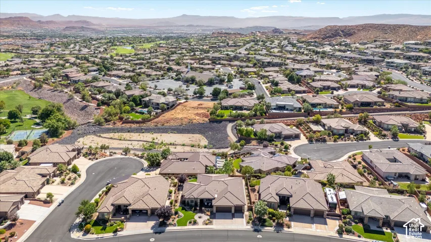 Aerial perspective showcasing a residential community with varied rooflines and landscaping