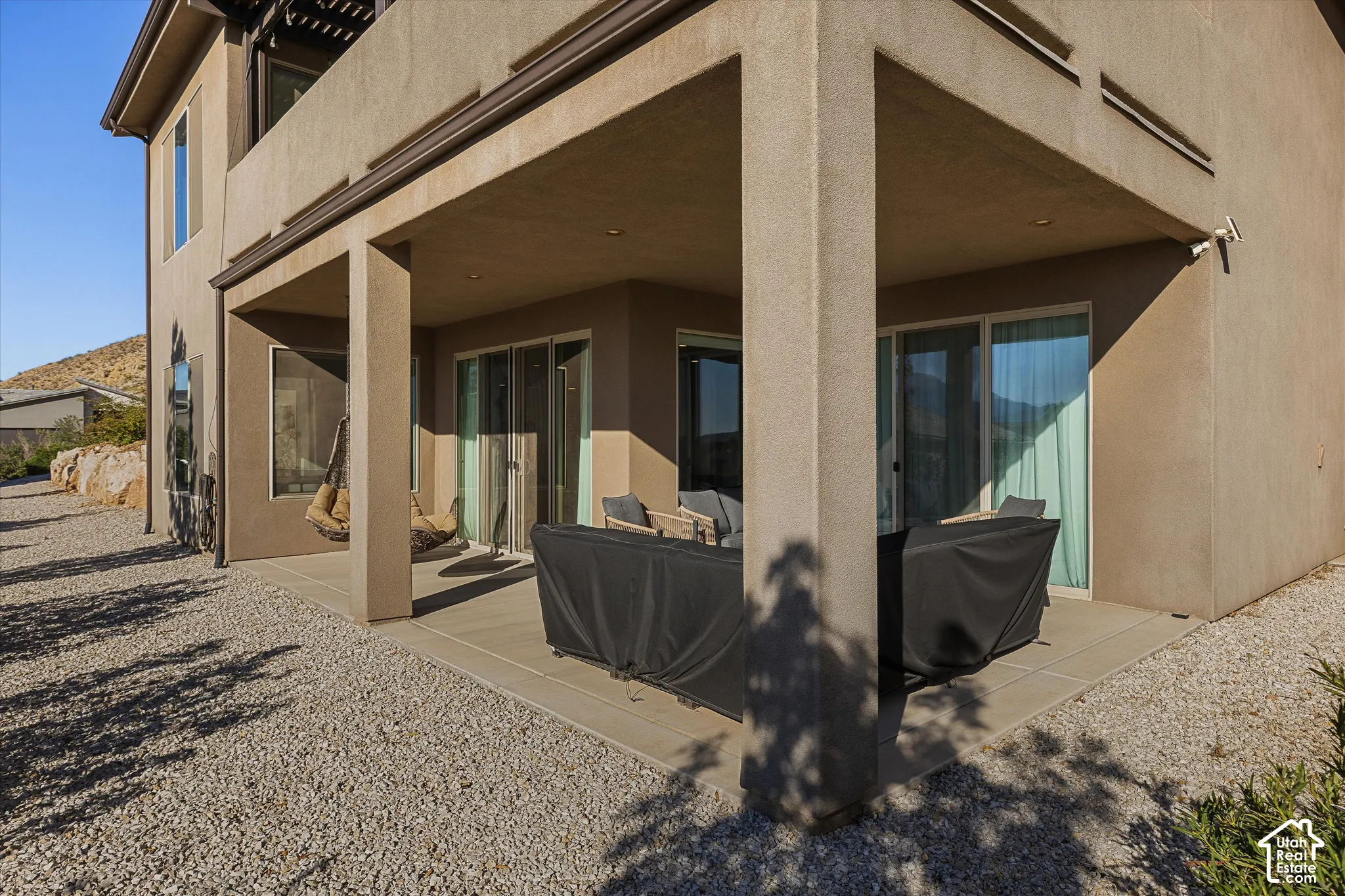 Covered patio with recessed lighting, stucco exterior, and sliding glass doors