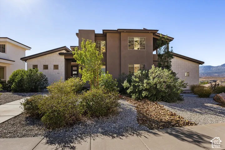 Modern facade featuring stucco and stone accents