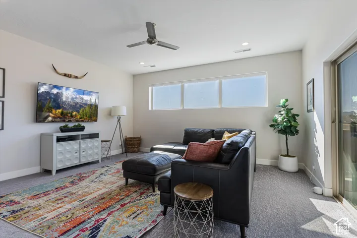 Recessed lighting, ceiling fan, and multiple windows provide ample illumination