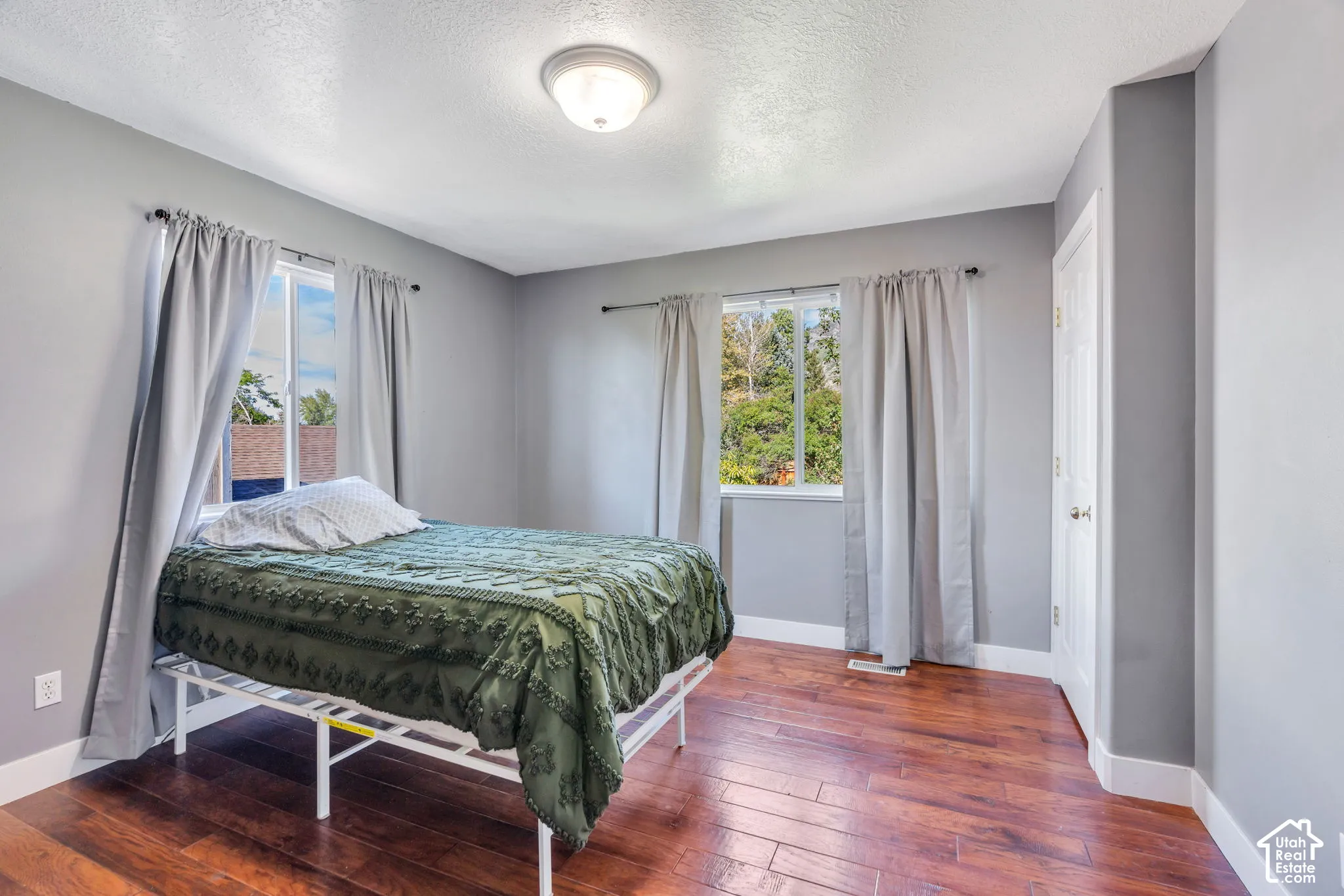 Hardwood-finish flooring, two windows, built-in closet