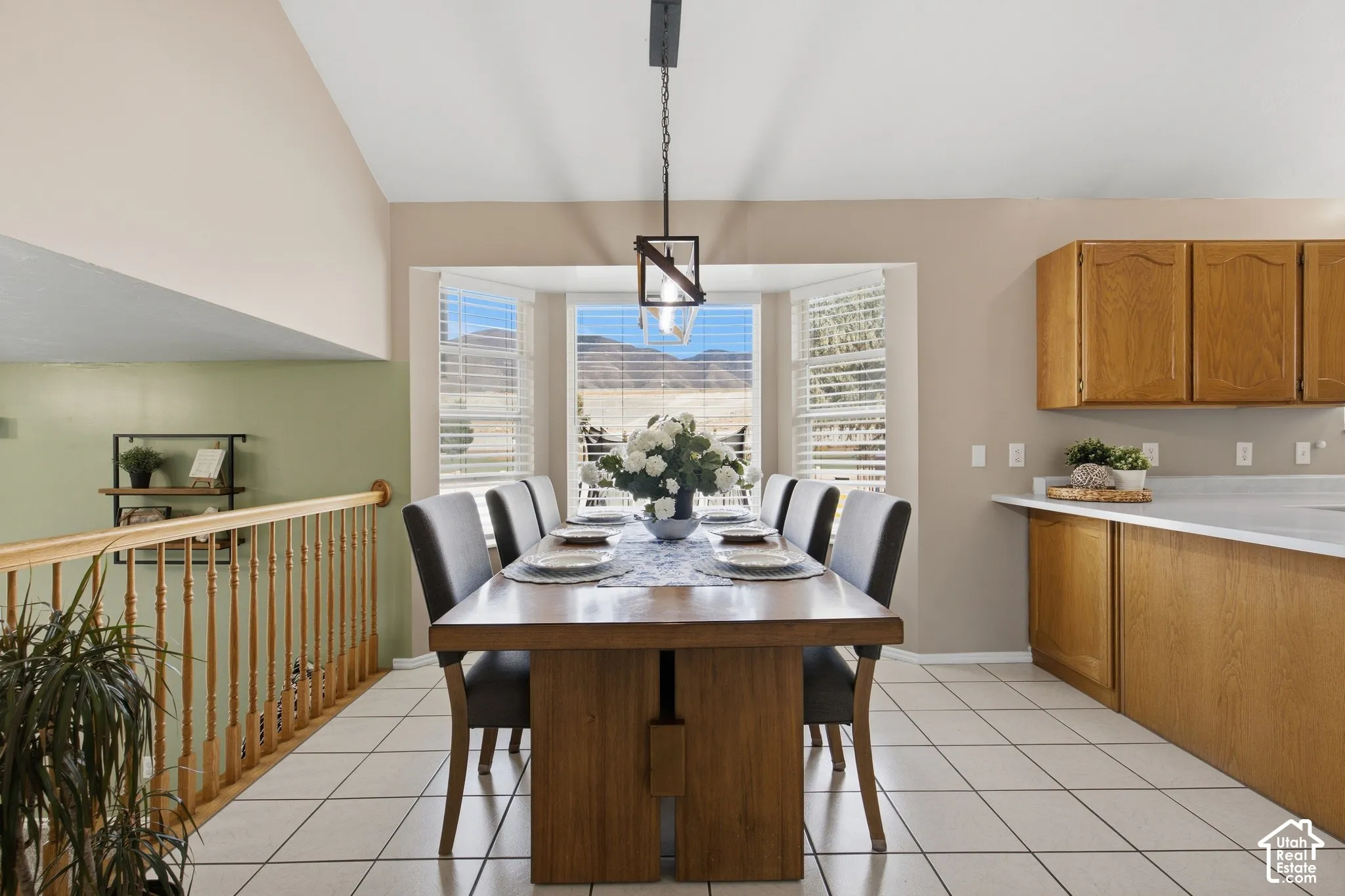 Tiled flooring and bay windows with mountain scenery