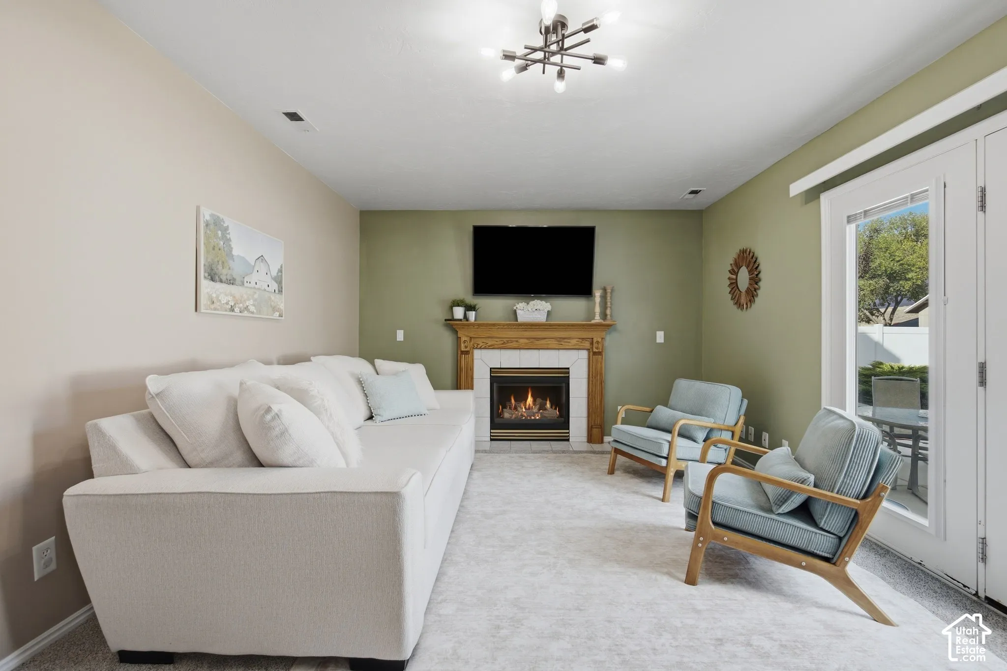 Built-in fireplace with a wooden mantel and tiled surround