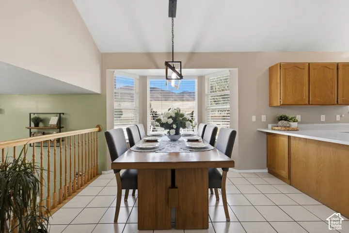 Tiled flooring and bay windows with mountain scenery