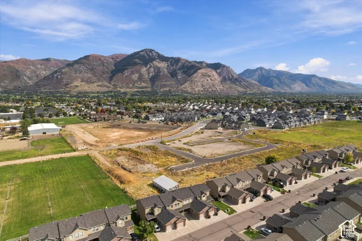 Expansive mountain backdrop with a developed residential community