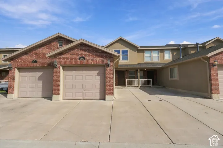 Brick veneer and stucco exterior with multiple gables