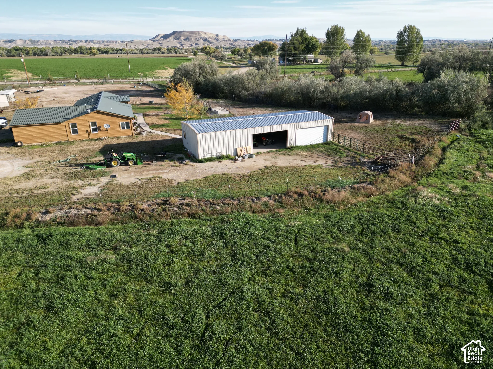Wood-sided residence featuring a metal roof