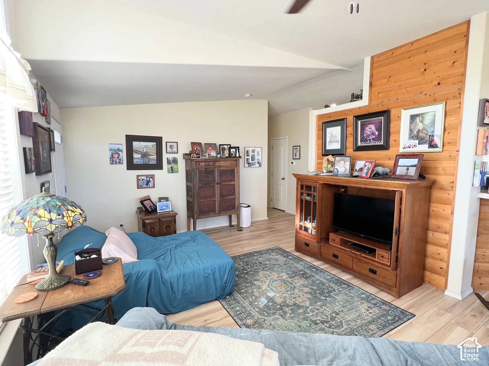 Vaulted ceiling and light wood-finish flooring
