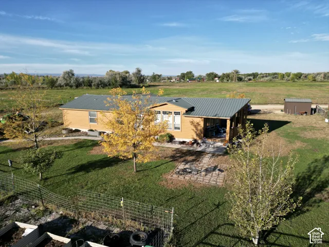 Single-story residence with siding exterior and a metal roof