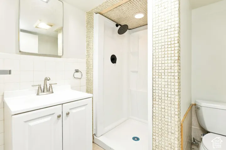White vanity with dual-door cabinetry and brushed nickel hardware