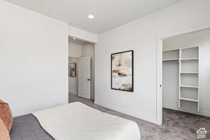 Plush carpet flooring, recessed ceiling lighting, and a built-in closet organization system Pictures are of the model home