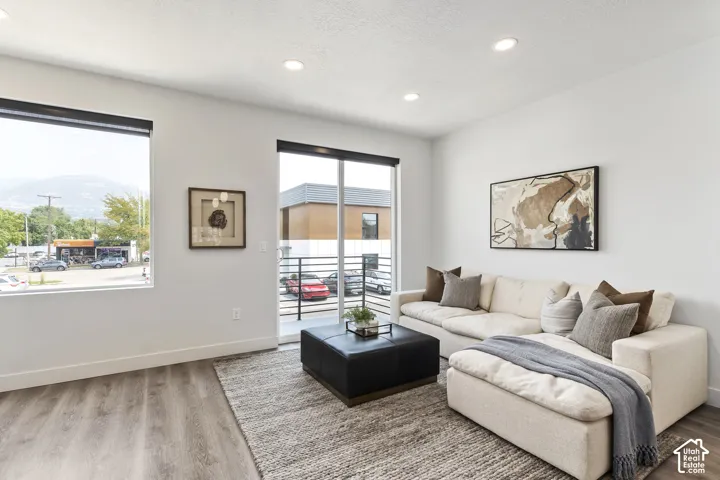 Recessed lighting, wood-finish flooring, and white walls Pictures are of the model home