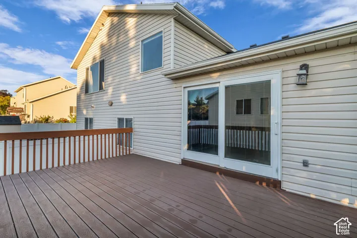 Expansive outdoor deck with composite decking and wood railing