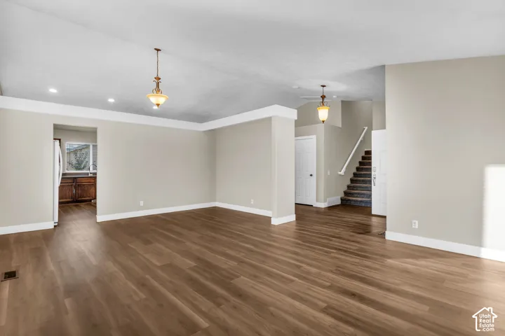 Vaulted ceiling  recessed lighting, and LVP flooring
