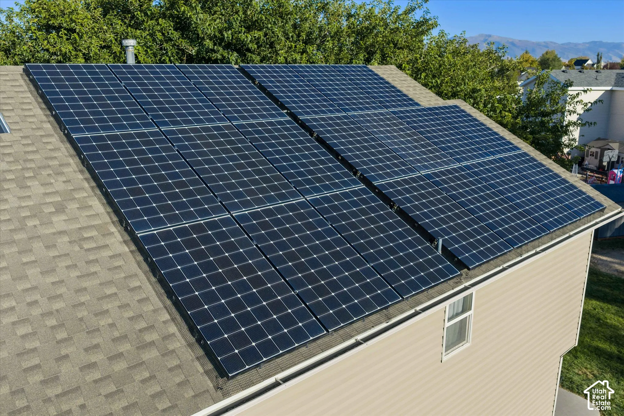 Rooftop solar panel array on an asphalt shingle roof