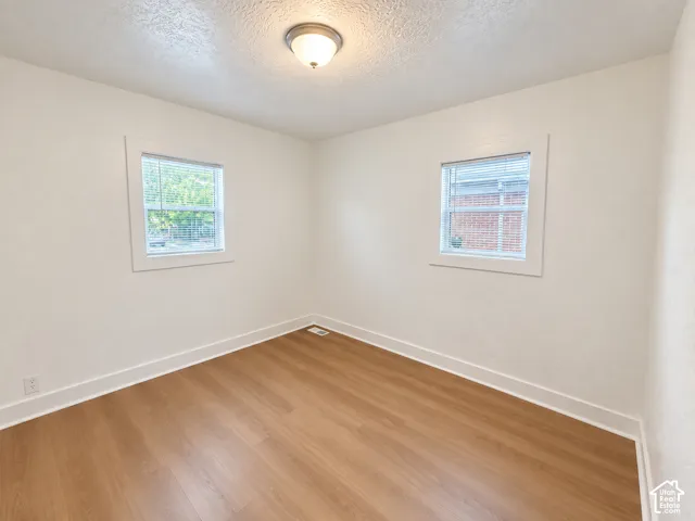Wood-finish flooring with crisp white trim