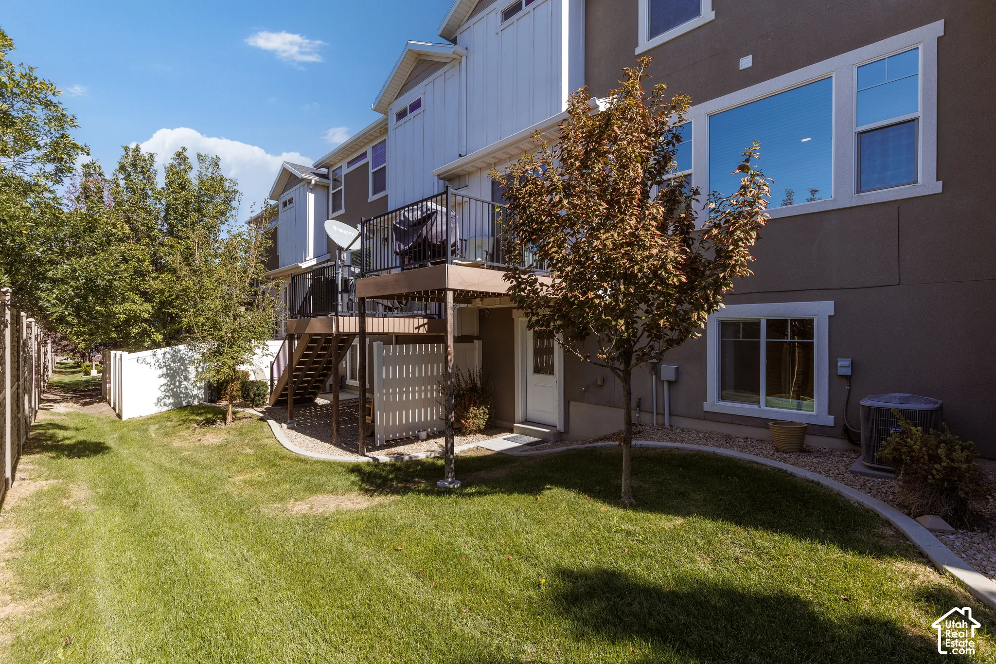 Private exterior deck with dark railings
